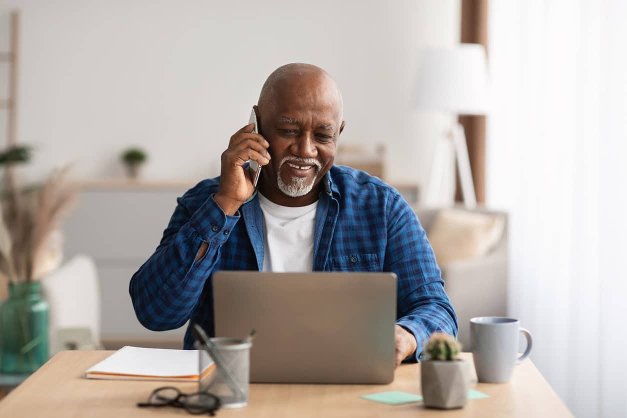 Mature man on the phone with a medicare advisor